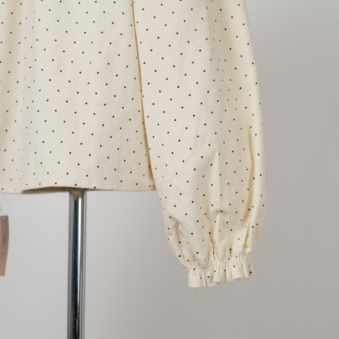 コールテンドットのフリルネック